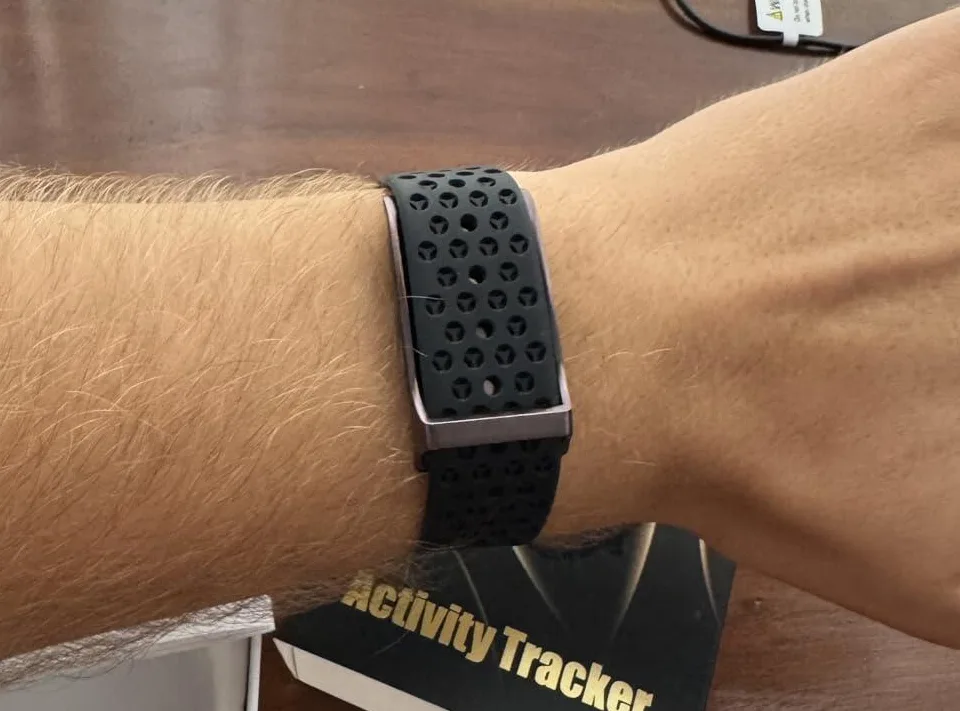 Black H59 band with perforated strap worn on a wrist
