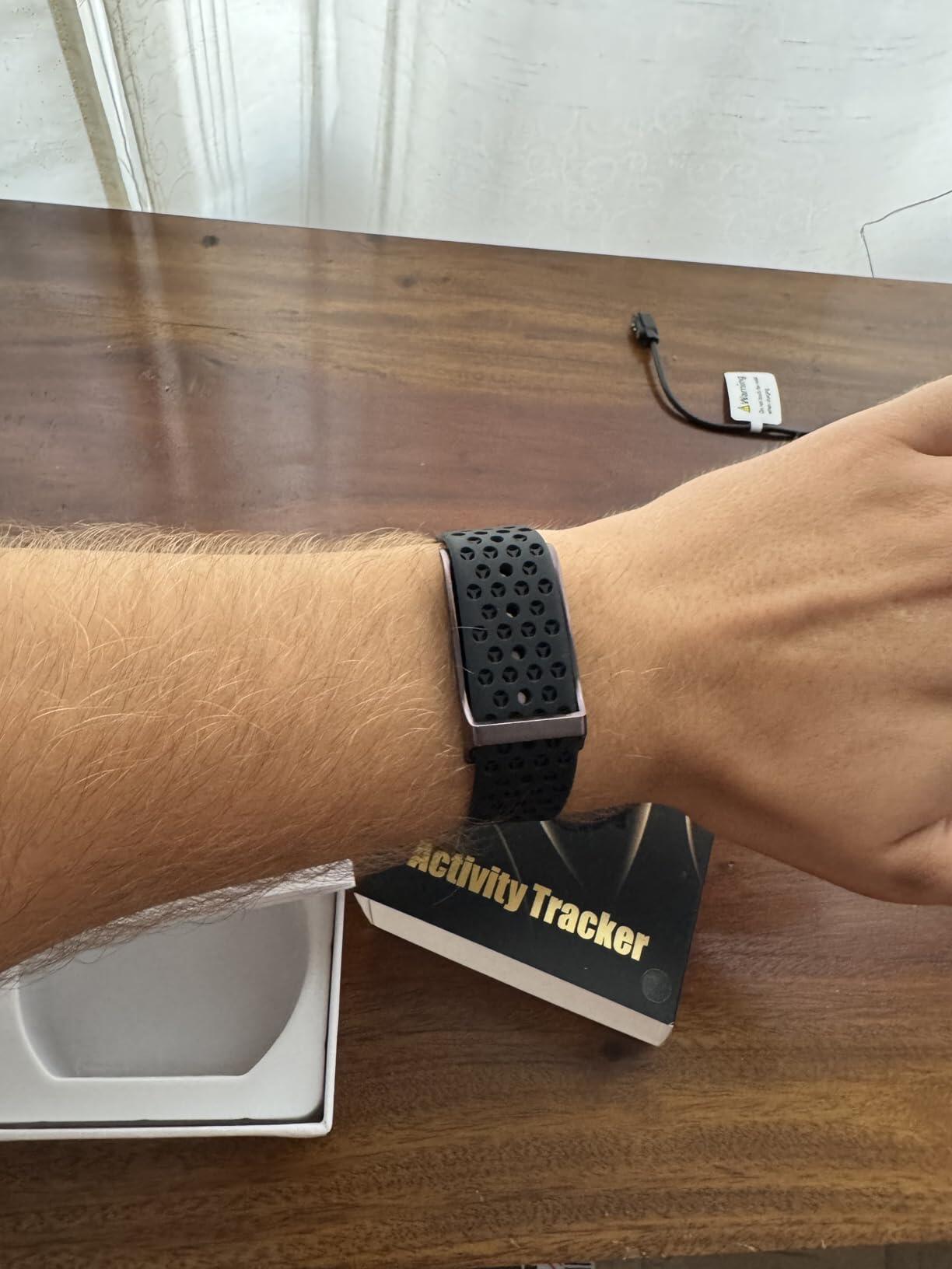 Black H59 band with perforated strap beside its packaging
